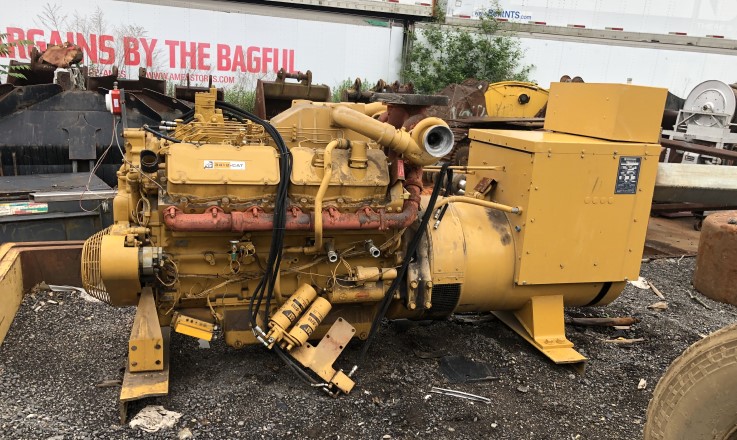 Open industrial generator set ready for removal